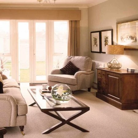 Lounge with cream sofa and carpet