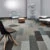Random chairs displayed on a grey office floor