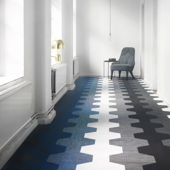 Elegant hallway with geometric patterned commercial flooring