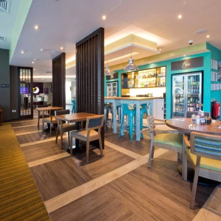 Hotel eating area with wooden flooring