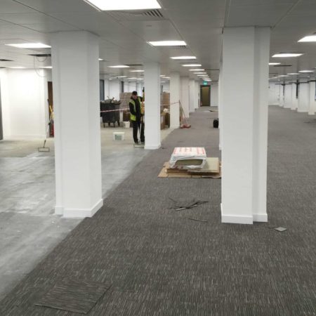 Contractors renovating office floor
