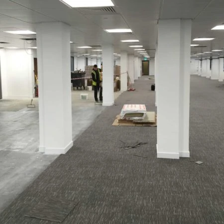 Contractors renovating office floor