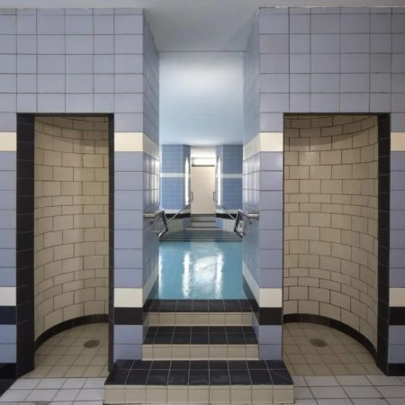 Tiled shower area of public swimming pool