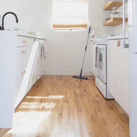 White kitchen with wooden floor