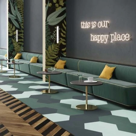 Dark green sofas in hotel foyer