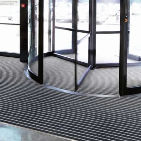 Rotating doors with mat on floor