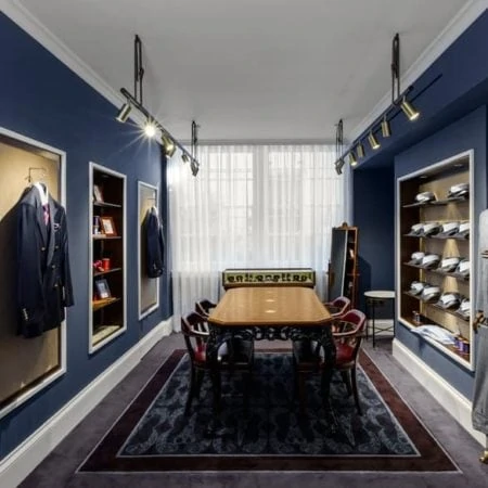 Table and chairs in men's clothing shop