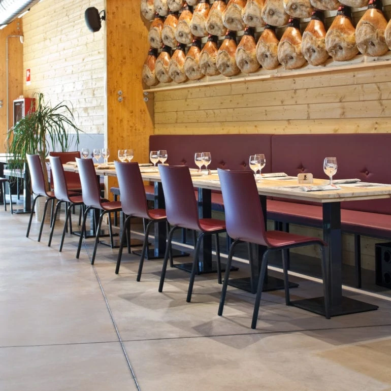 Line of tables in spacious restaurant