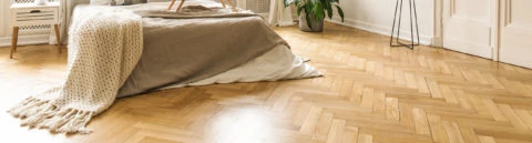 Sanded wooden floor of a bedroom