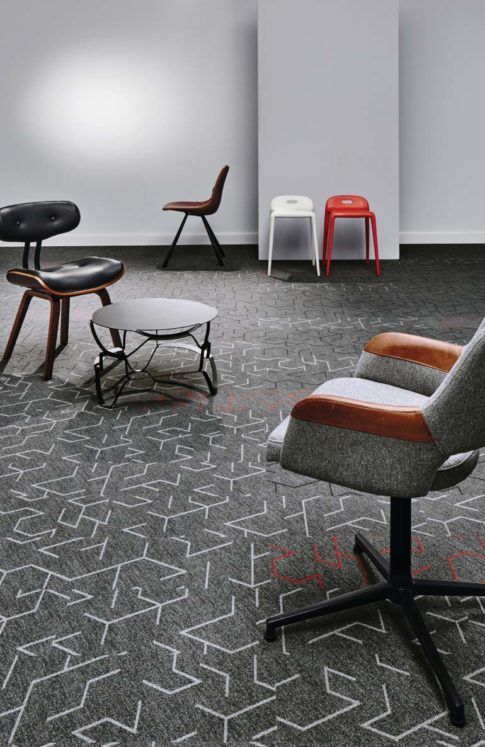 Random selection of office chairs on a grey carpet
