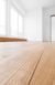 Plain white room with newly sanded wooden floor