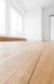 Plain white room with newly sanded wooden floor