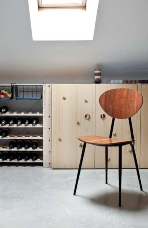 polished concrete floor in lofft extension with a chair and cupboards